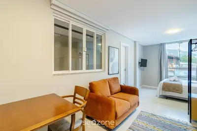 Uma cama ou camas num quarto em Estúdios na Barra em Balneário Camboriú - DPR
