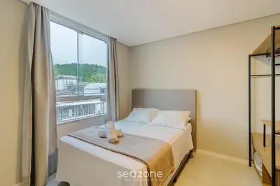 Uma cama ou camas num quarto em Estúdios na Barra em Balneário Camboriú - DPR