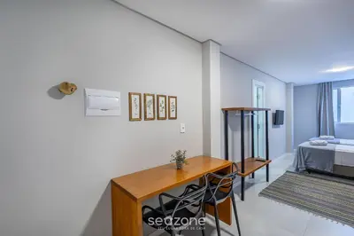 Uma cama ou camas num quarto em Estúdios na Barra em Balneário Camboriú - DPR