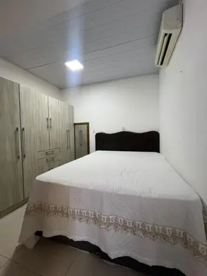 Uma cama ou camas num quarto em Casa a 1 km da praia