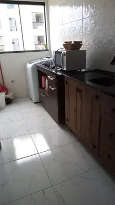 A cozinha ou kitchenette de Apto Tijucas lá vie