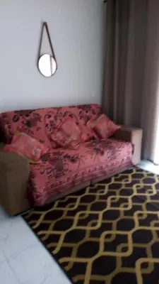 Uma cama ou camas num quarto em Apto Tijucas lá vie