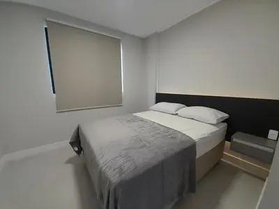 Uma cama ou camas num quarto em Apartamento aconchegante em Mariscal