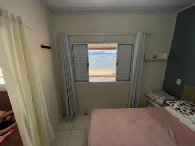 Uma cama ou camas num quarto em Casinha de GCR