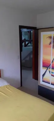 Uma cama ou camas num quarto em Residencial vista panorâmica