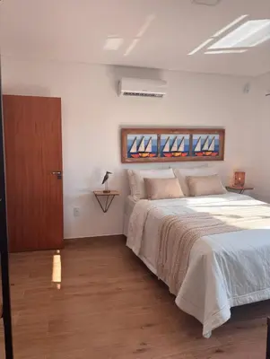 Uma cama ou camas num quarto em Duplex com hidro - 200m da Praia de Mariscal