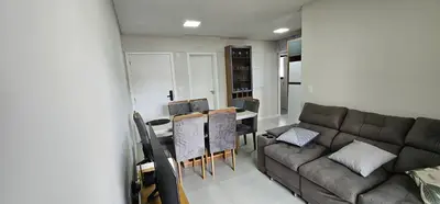 Uma área de estar em Apartamento 3 quartos com suíte