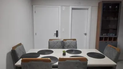 Uma área de estar em Apartamento 3 quartos com suíte