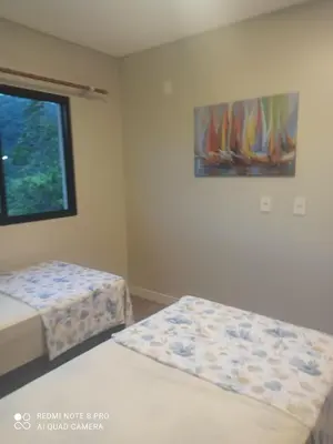 Uma cama ou camas num quarto em Casa Jade duplex nova com piscina em Mariscal, Bombinhas
