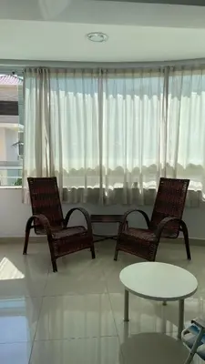 Uma área de estar em Apartamento Porto Belo