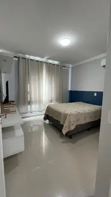 Uma cama ou camas num quarto em Apartamento Porto Belo