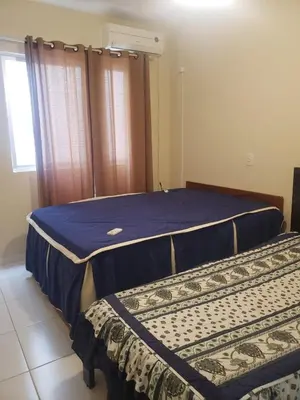 Uma cama ou camas num quarto em Solar Itapema