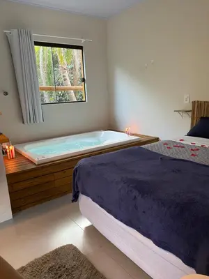 Uma cama ou camas num quarto em Loft Para Casais com Jacuzzi - Geminado - Unidade 2 Sunset - Sem Café da Manã