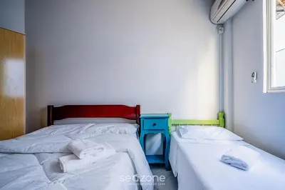 Uma cama ou camas num quarto em Apto c/churrasq. a 3min da Praia de Bombas FDL101