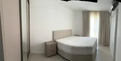 Uma cama ou camas num quarto em Apartamento meia praia itapema SC 3 suítes