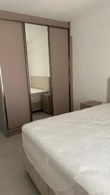 Uma cama ou camas num quarto em Apartamento meia praia itapema SC 3 suítes