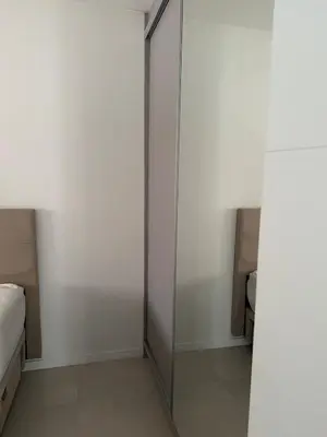 Uma cama ou camas num quarto em Apartamento meia praia itapema SC 3 suítes
