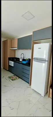 A cozinha ou kitchenette de Apartamento novíssimo, perto do mar