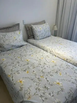 Uma cama ou camas num quarto em Lindo apartamento próximo do mar novinho