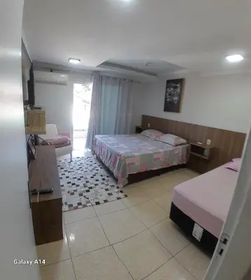 Uma cama ou camas num quarto em Casa de praia meu encanto