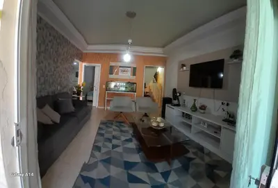 Uma televisão e/ou sistema de entretenimento em Casa de praia meu encanto