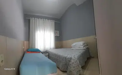 Uma cama ou camas num quarto em Casa de praia meu encanto