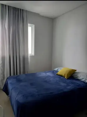 Uma cama ou camas num quarto em Dom basilio