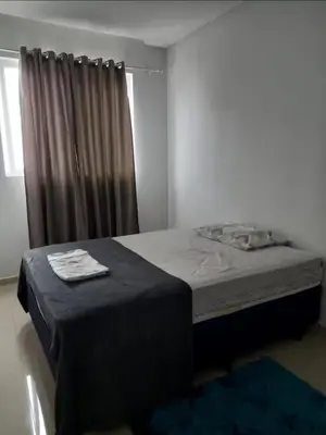 Uma cama ou camas num quarto em Dom basilio