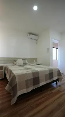 Uma cama ou camas num quarto em Pousada Areia Cristal