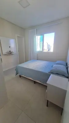 Uma cama ou camas num quarto em Apartamento no centro de Itapema
