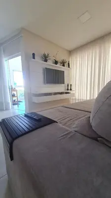 Uma televisão e/ou sistema de entretenimento em Apartamento no centro de Itapema