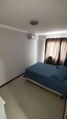 Uma cama ou camas num quarto em Half Beach Apartment - Itapema