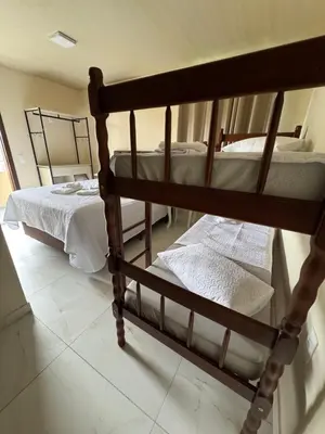 Uma cama ou camas num quarto em Residencial Lara 7