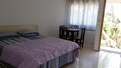 Uma cama ou camas num quarto em Cantinho do Bê
