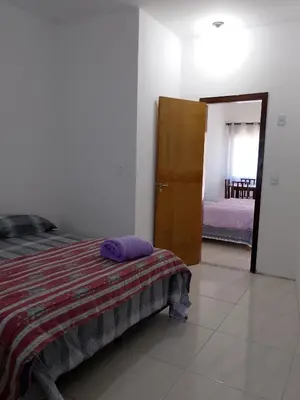 Uma cama ou camas num quarto em Cantinho do Bê
