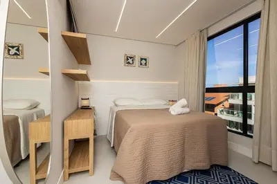 A planta de Di Ravena 101 - Apartamento Moderno em Canto Grande a 120 Metros do Mar.