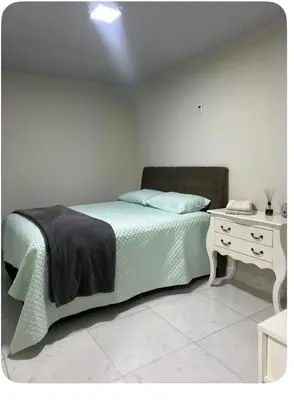 Uma cama ou camas num quarto em Casa cinza