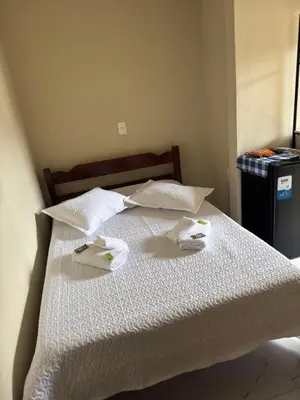 Uma cama ou camas num quarto em Residencial Lara 2