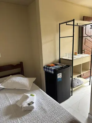 Uma cama ou camas num quarto em Residencial Lara 2