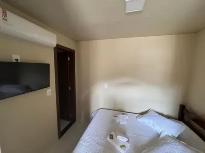 Uma cama ou camas num quarto em Residencial Lara 2