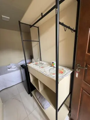 Uma cama ou camas num quarto em Residencial Lara 2
