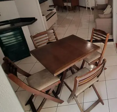 Uma área de estar em Apartamento pé na areia em Meia Praia com churrasqueira com vista mar