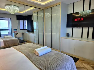 Uma cama ou camas num quarto em Vista Panorâmica| Elegante 3 Suítes |CURTA173