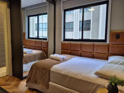 Uma cama ou camas num quarto em Vista Panorâmica| Elegante 3 Suítes |CURTA173