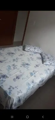 Uma cama ou camas num quarto em Casa do Zeca