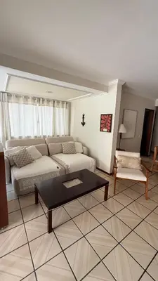 Uma área de estar em Cobertura quadra MAR em Meia Praia - 100m do mar
