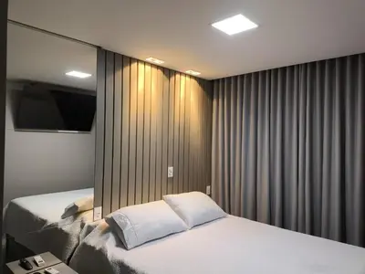 Uma cama ou camas num quarto em Flat Infinity