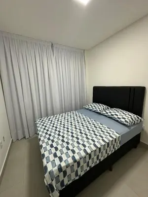 Uma cama ou camas num quarto em Apto novo Itapema
