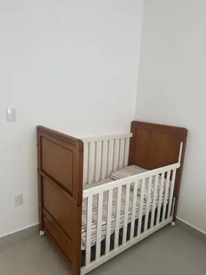 Uma cama ou camas num quarto em Apto novo Itapema