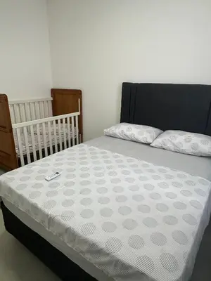 Uma cama ou camas num quarto em Apto novo Itapema